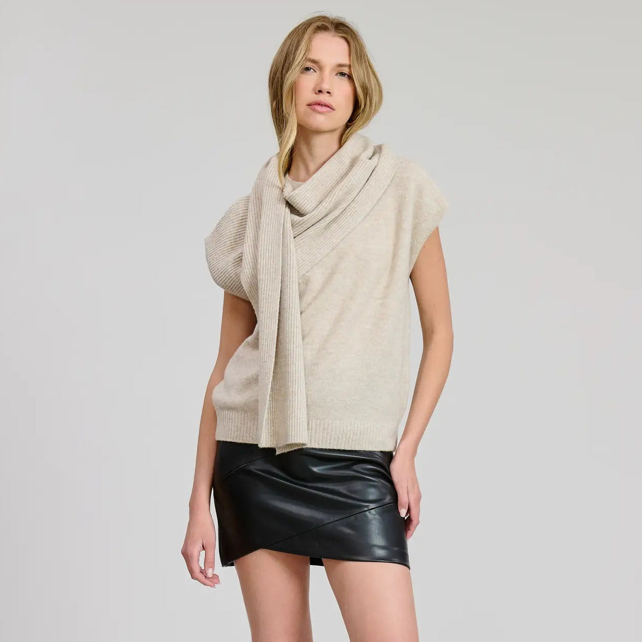 A woman wearing the Thun Sweater Vest with Scarf by Flat White
