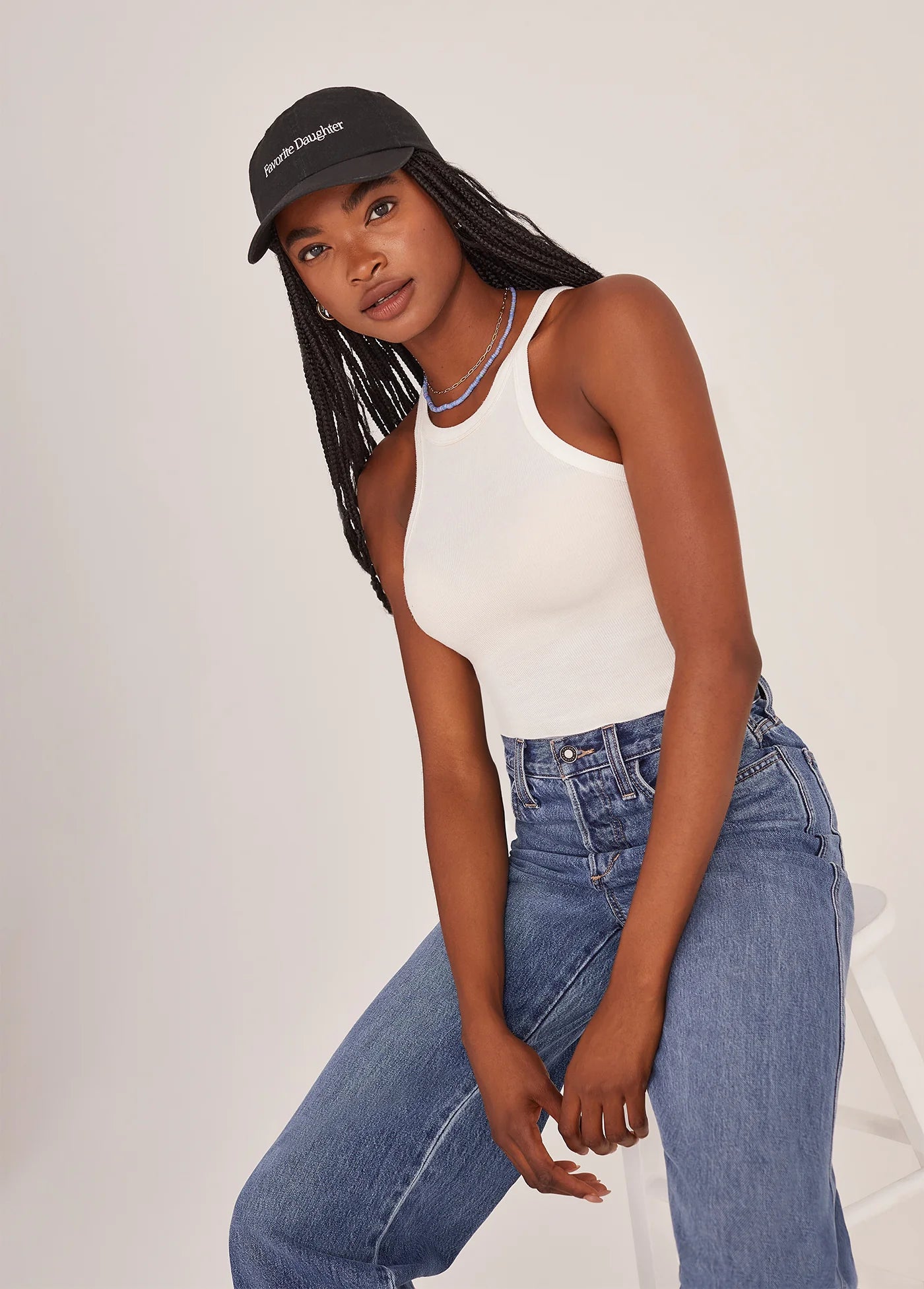 A woman wearing the Favorite Daughter Classic Logo Baseball Hat in the color Black