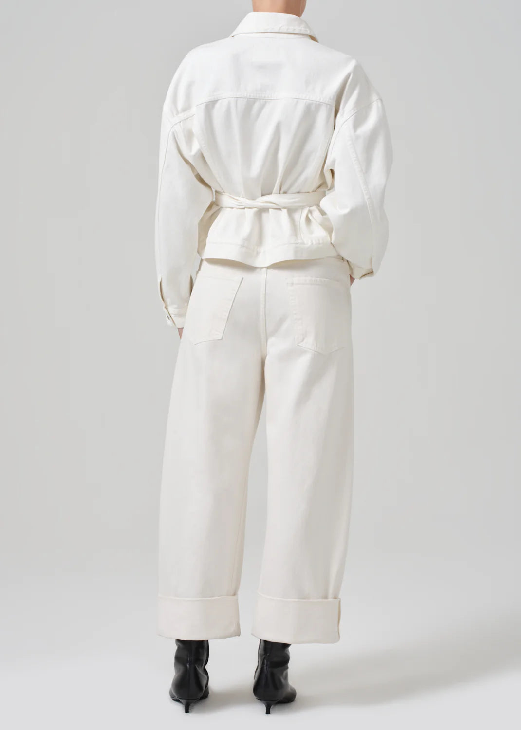 Back view of a woman wearing the Ayla Baggy Wide-Leg Women's Jeans in the color off-white color Pashmina