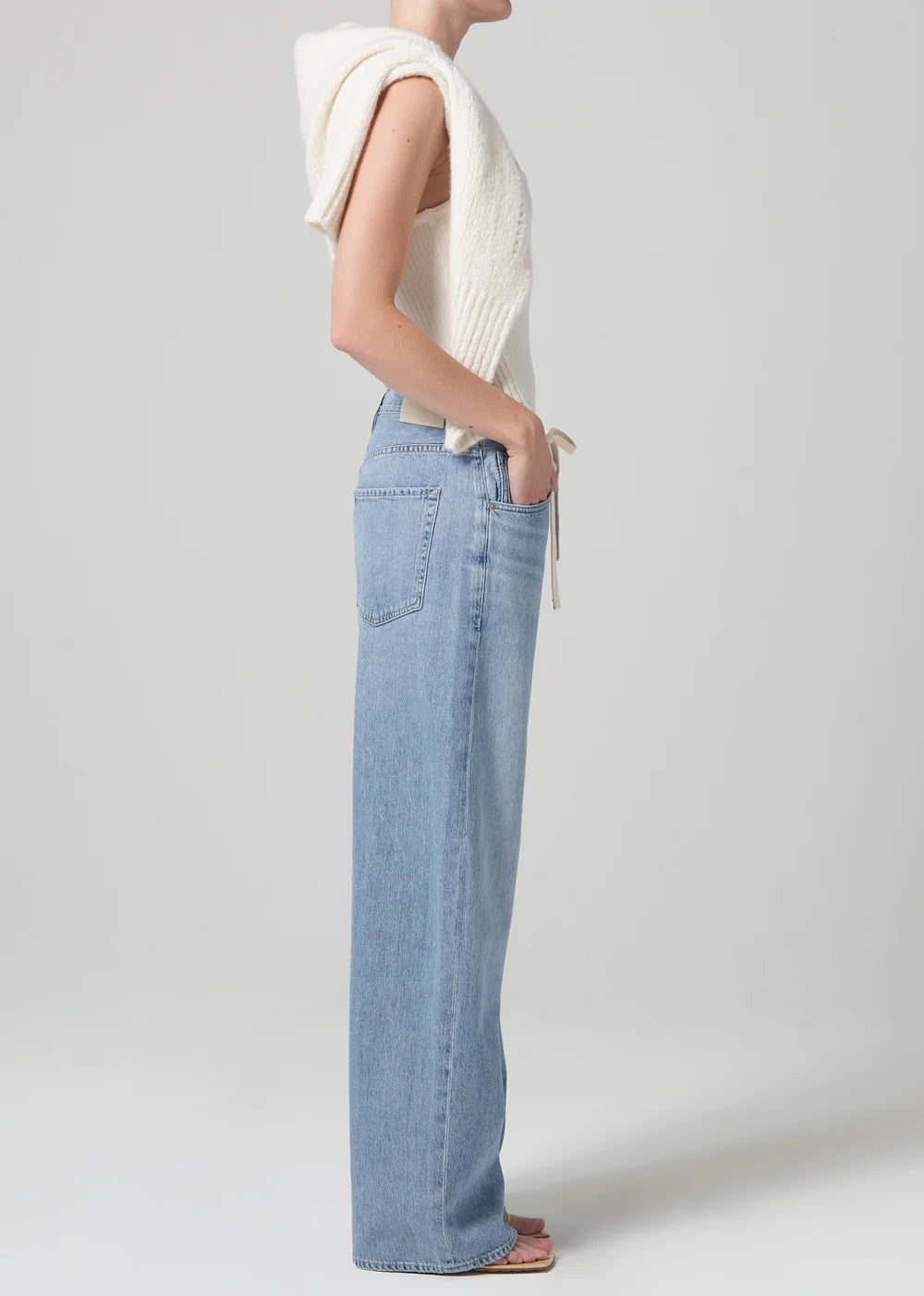 Side view of model wearing the light indigo Brynn Drawstring Trouser by Citizens of Humanity