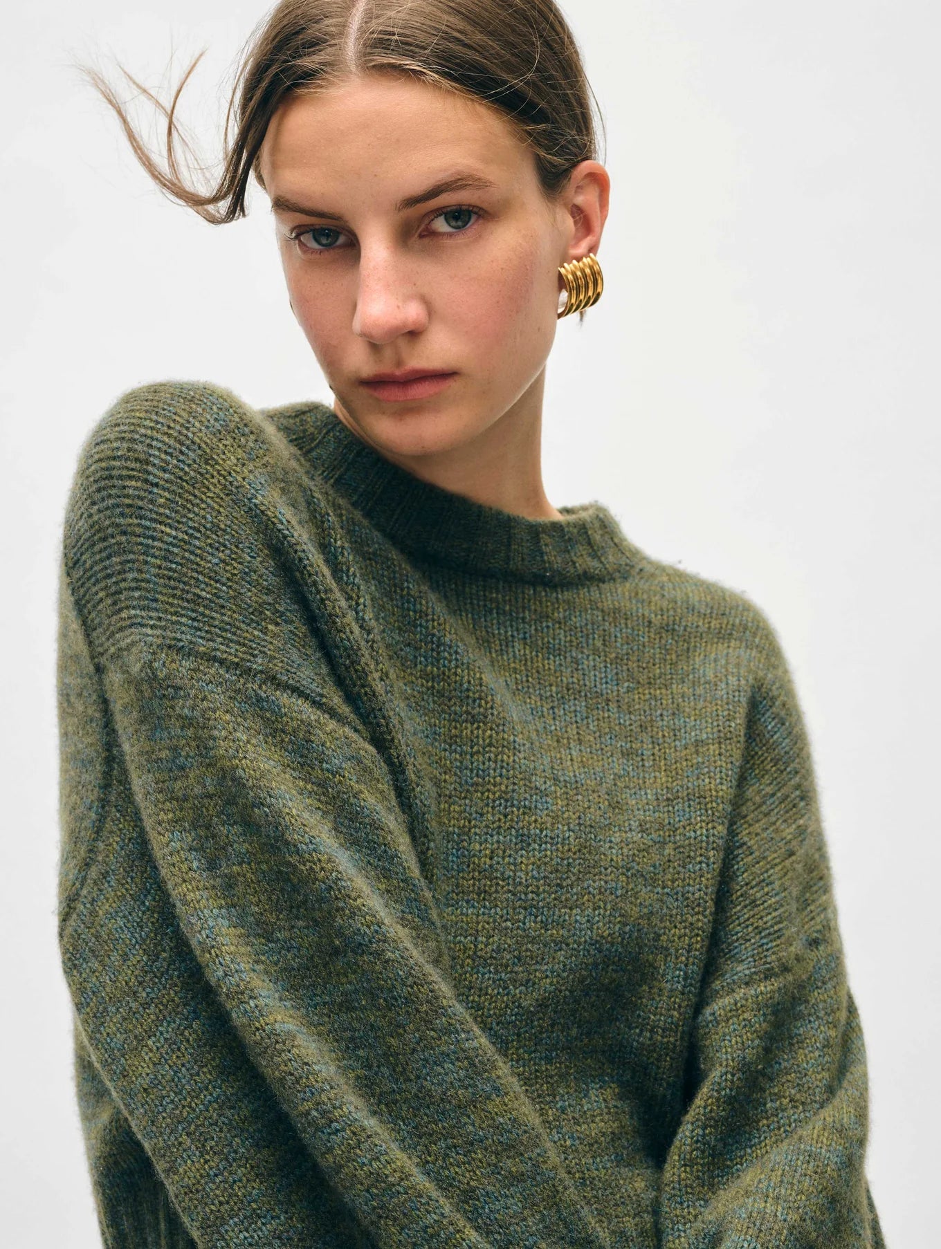 Front detail on the Cashmere Luxe Crewneck in the color Green Marl by the brand White + Warren