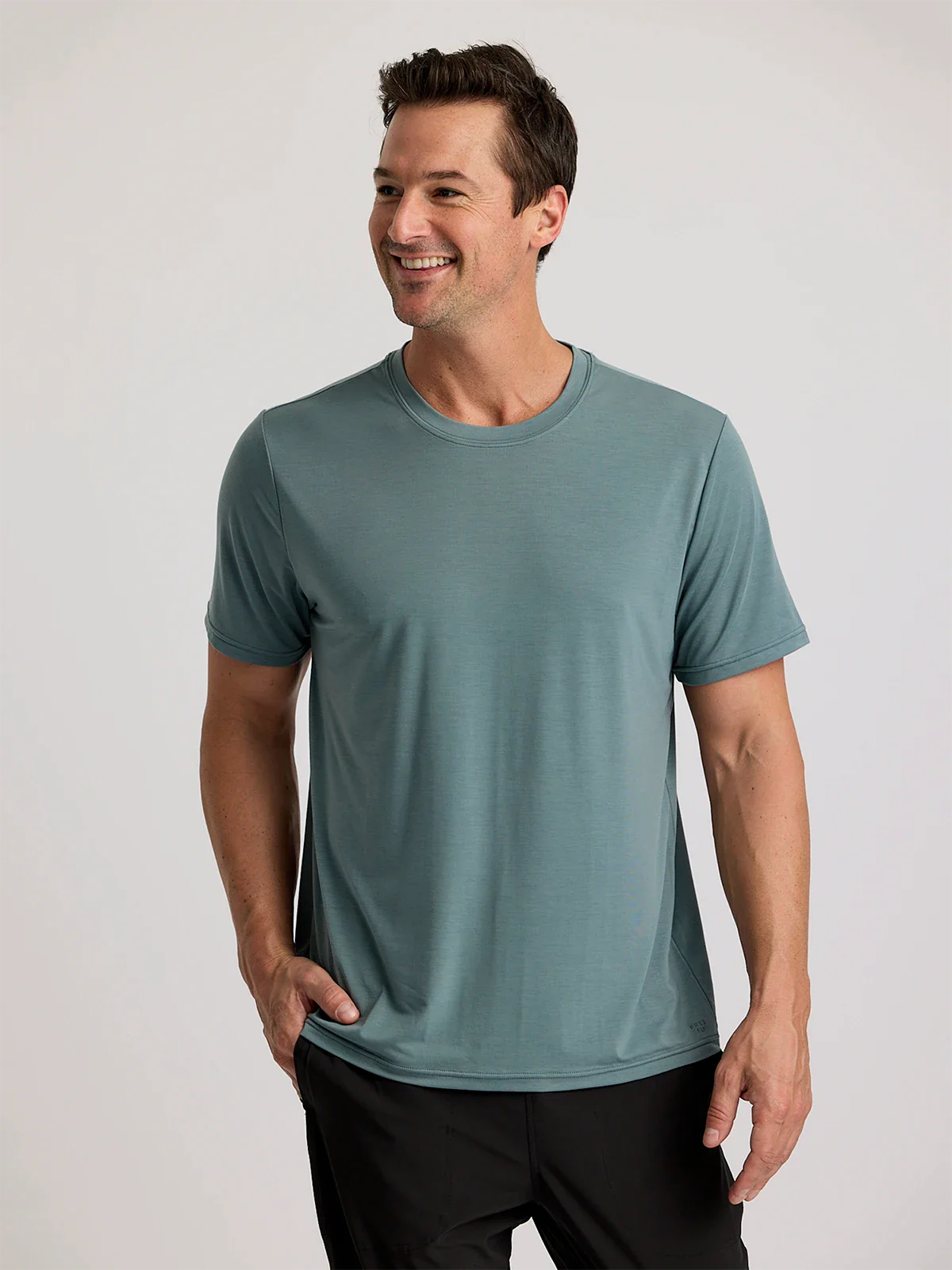 Shop the Free Fly Men's Elevate Lightweight Tee in the color Stormy Sea at Harbour Thread men's store in St. Petersburg, FL.