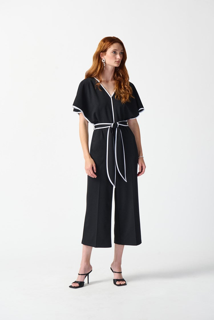 Front view of a woman wearing the Joseph Ribkoff Scuba Crepe Belted Jumpsuit in the colors Midnight Blue and Vanilla