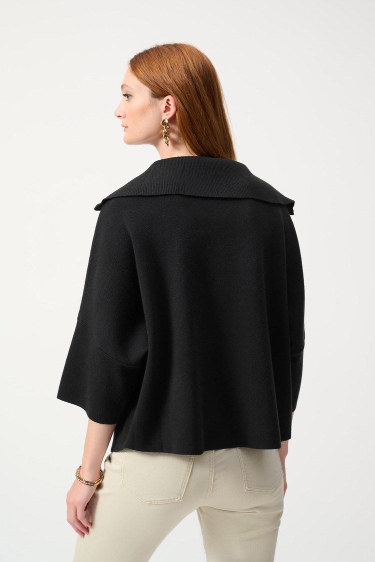 This sophisticated quarter zip sweater offers a relaxed fit