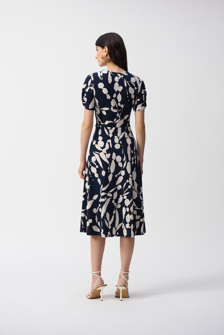 The Silky Knit Abstract Print Wrap Dress from Joseph Ribkoff offers a slightly flowy fit and flare silhouette