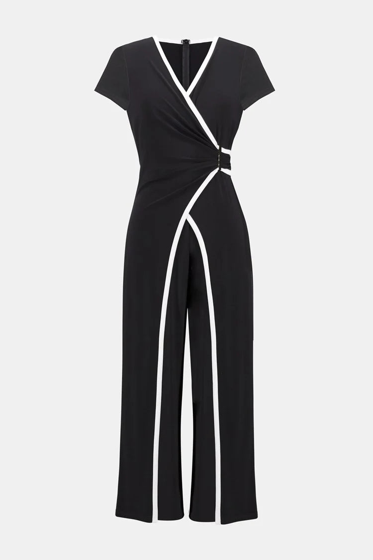 Luxurious silky knit jumpsuit with a polished wrap bodice, cap sleeves, and a bold culotte silhouette