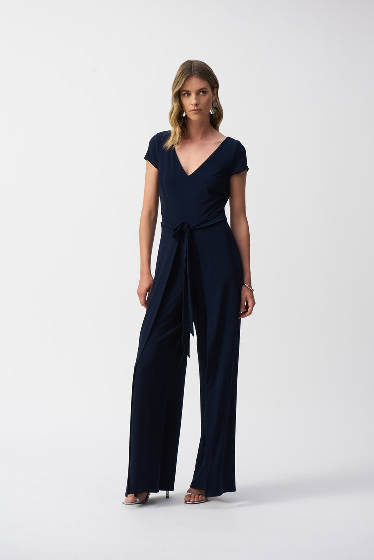 Front view of the Silky Knit Wide-Leg Jumpsuit from Joseph Ribkoff, featuring a v-neckline and short sleeves