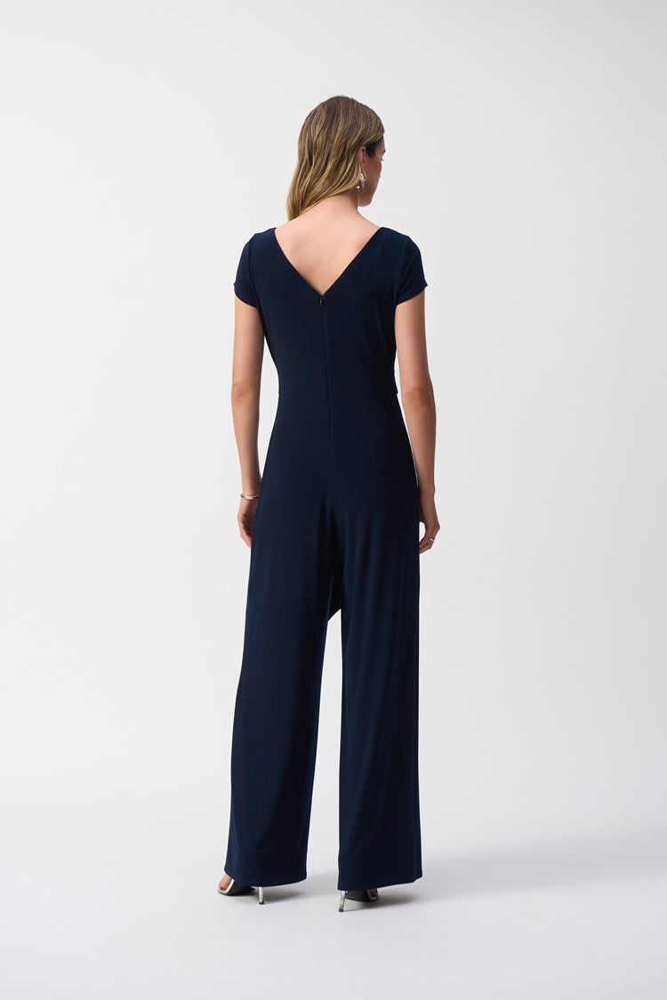 Silky knit jumpsuit with a wide leg, V-neck and v-backi, and waist tie