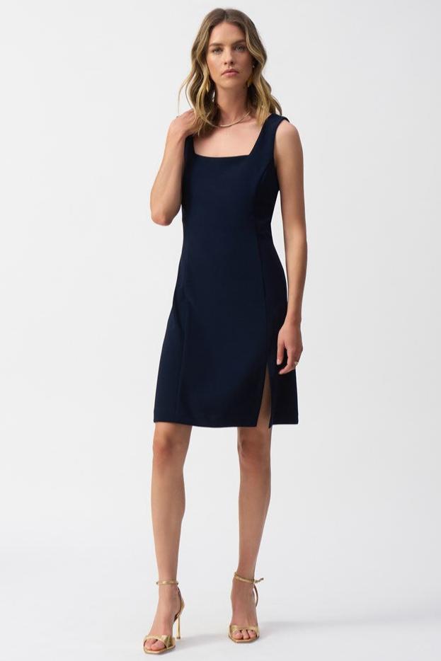 The Silky Knit Sleeveless Sheath Dress from Joseph Ribkoff in the color Midnight Blue, featuring a mini silhouette with a small side slit