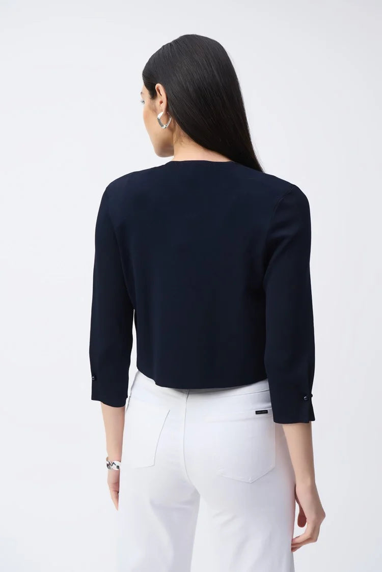 This sweater knit coverup from Joseph Ribkoff offers a 3/4 sleeve design in a cropped length