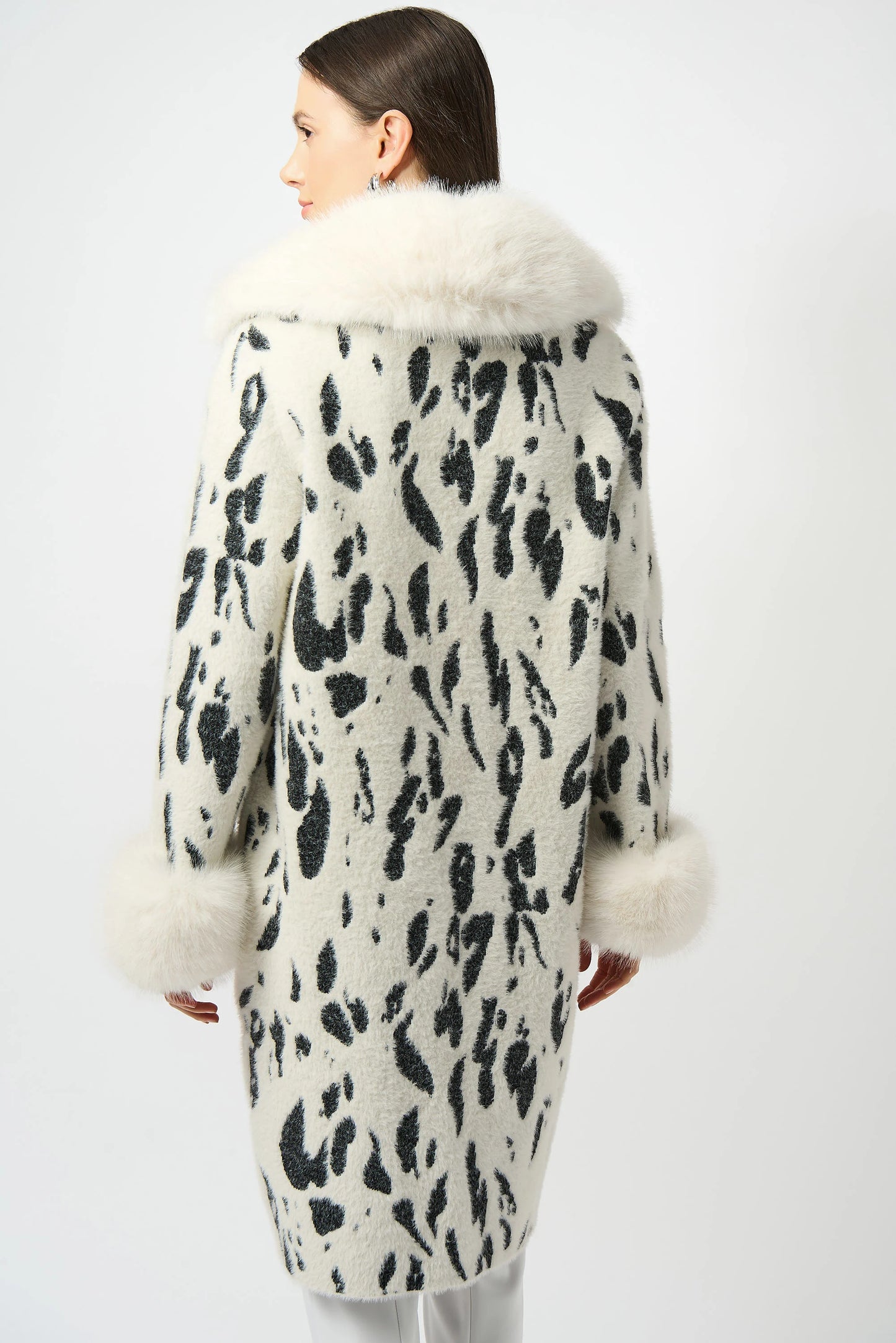 Woman wearing an animal print faux fur coat