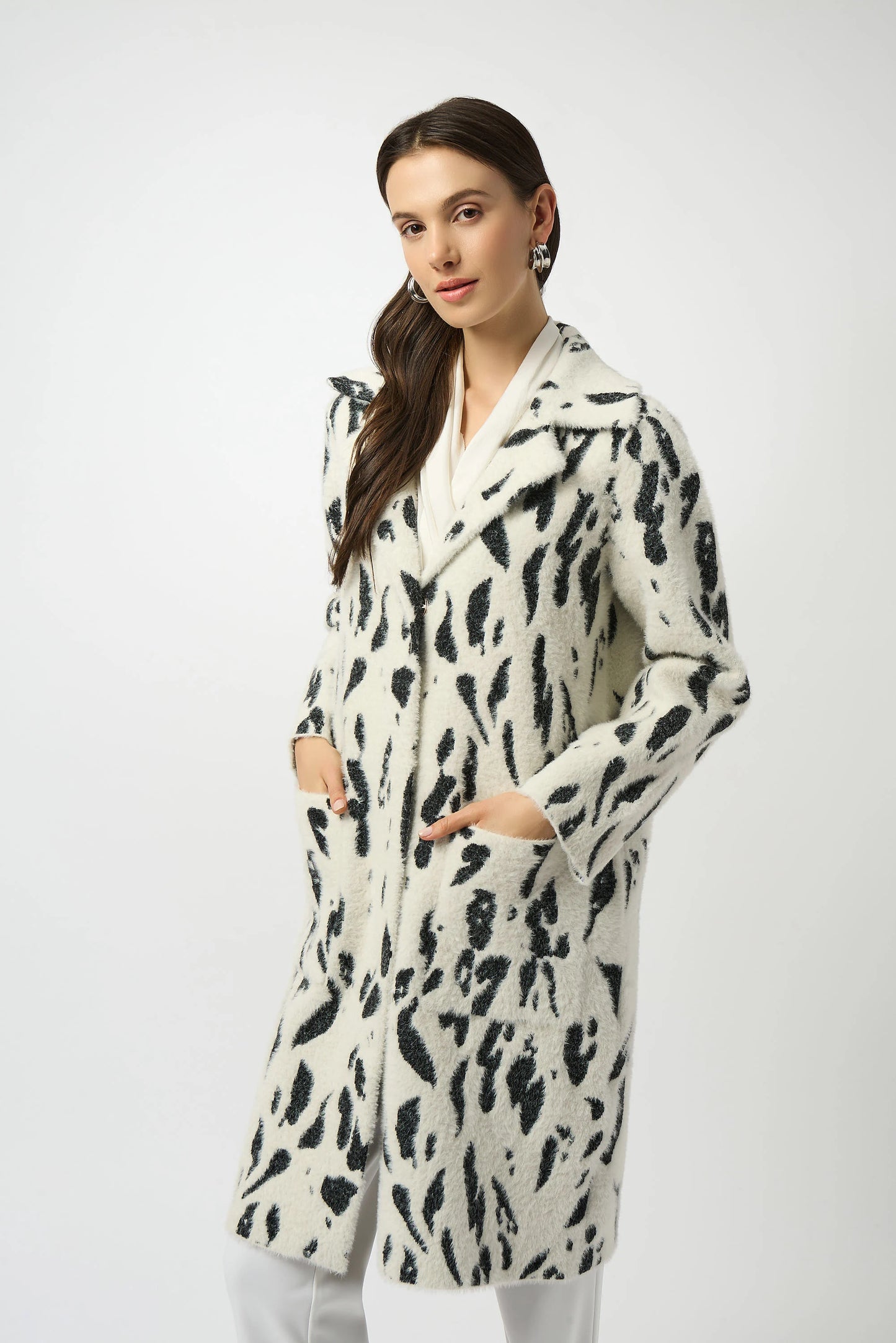 Woman wearing a black and white jacket with pockets