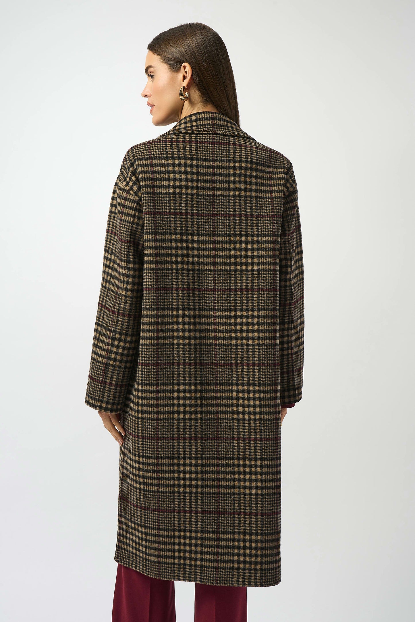 Woman wearing a long plaid wool blend coat from Joseph Ribkoff