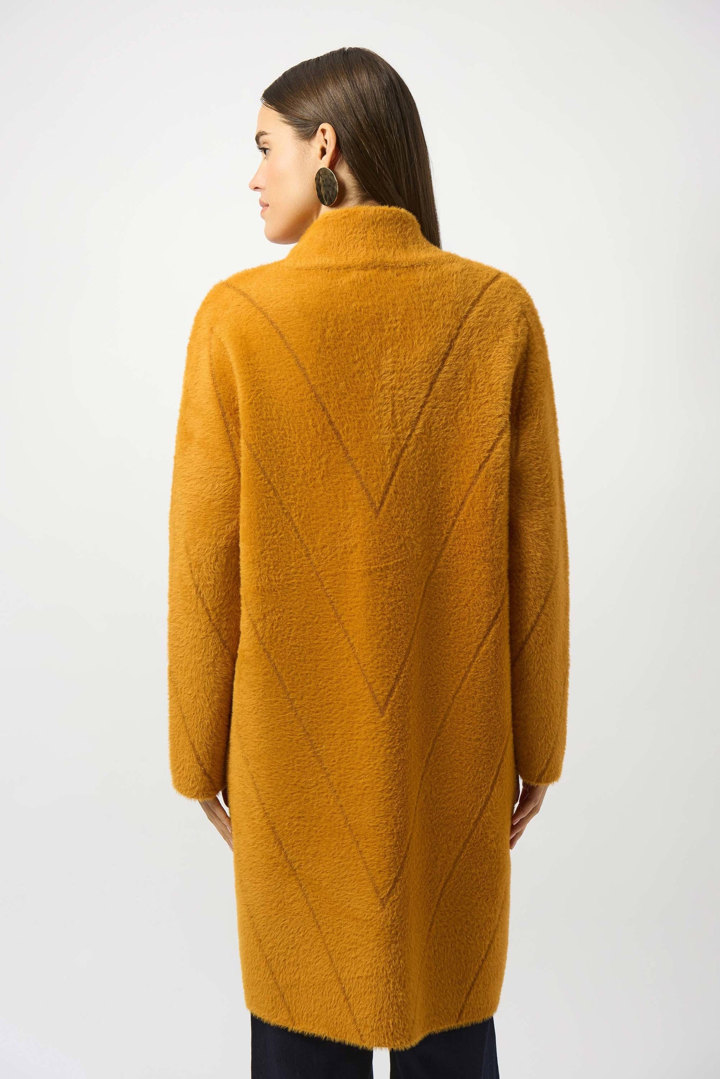Woman wearing a mustard yellow coat