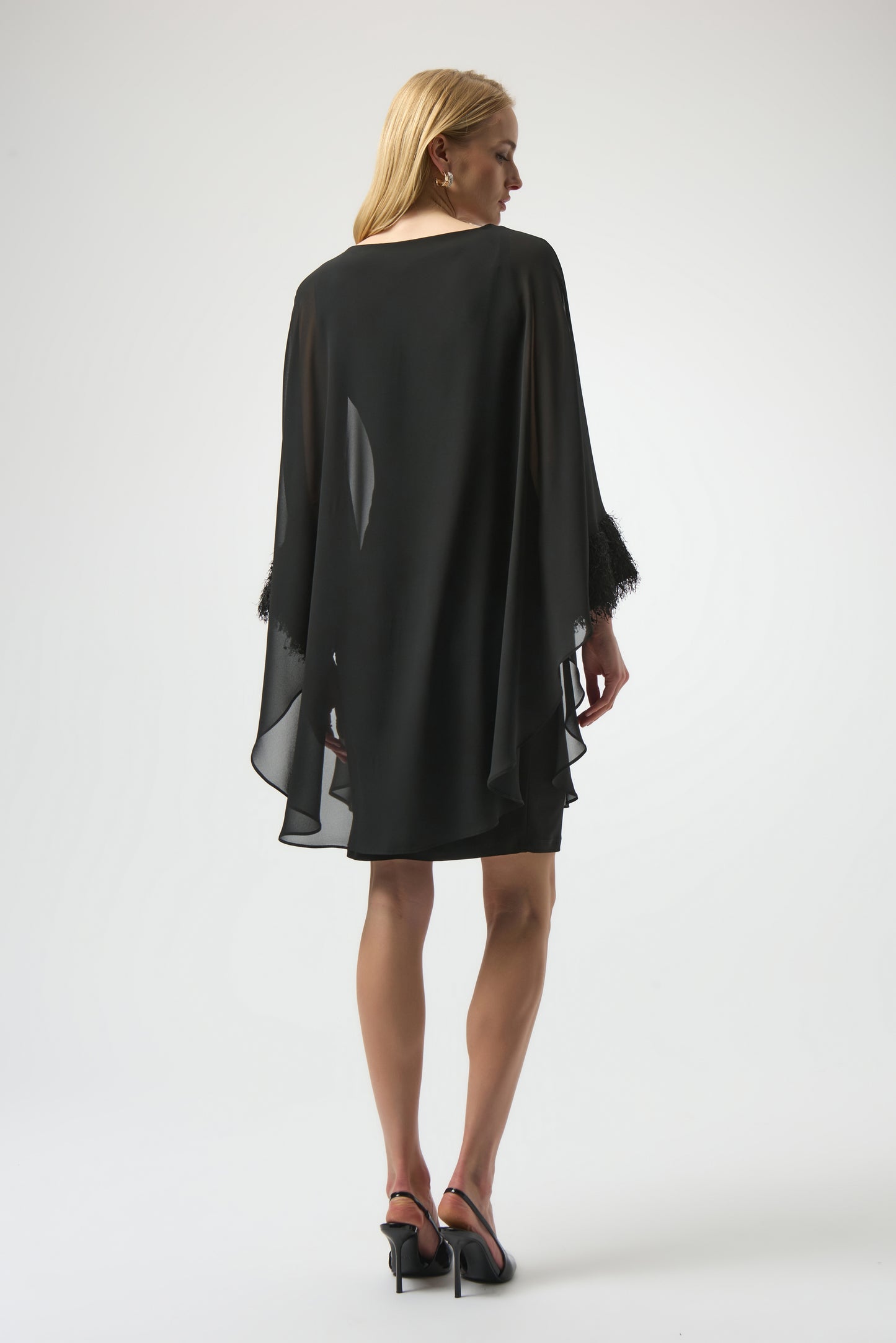 Woman wearing a black dress from Joseph Ribkoff