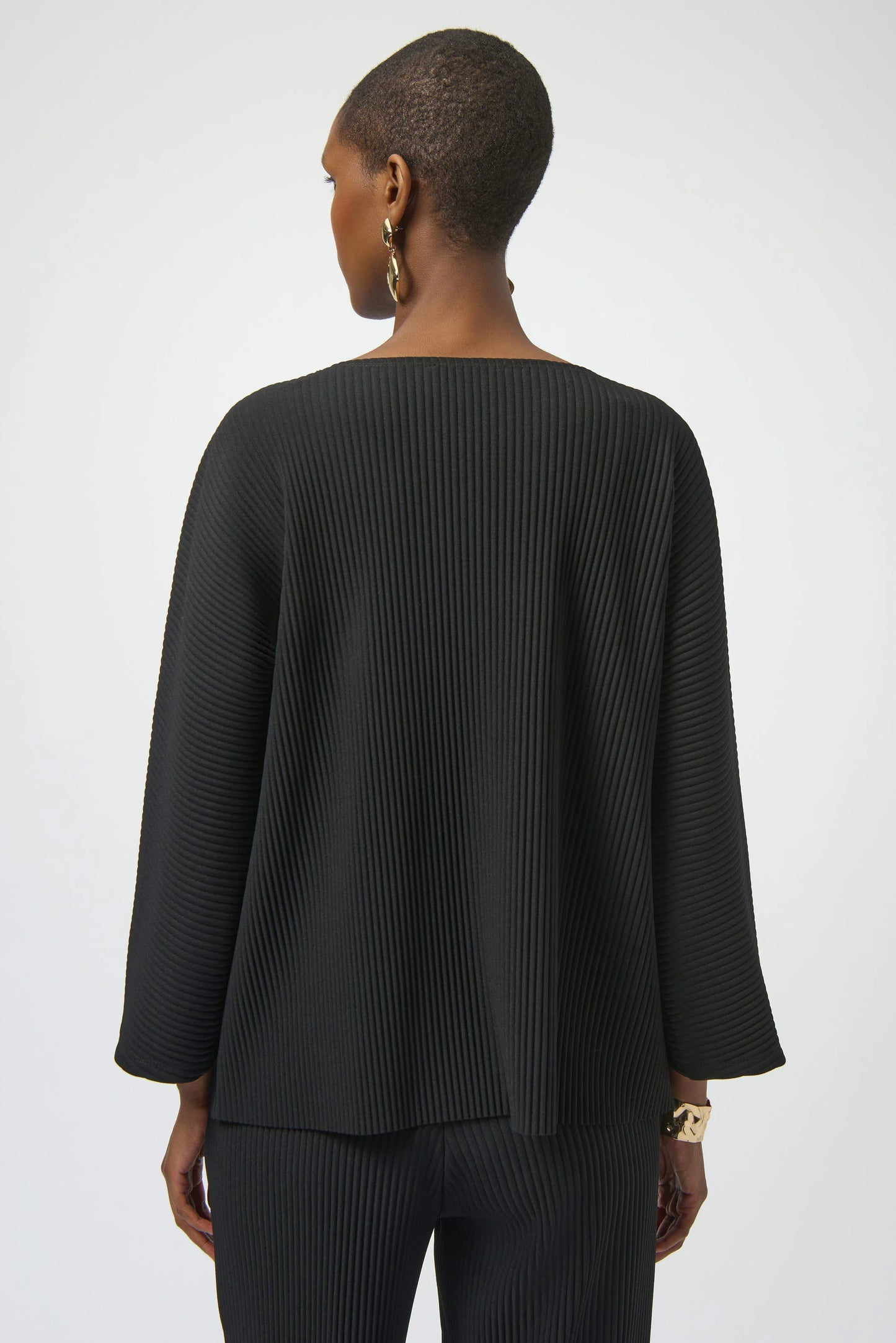 Woman wearing a black top from Joseph Ribkoff