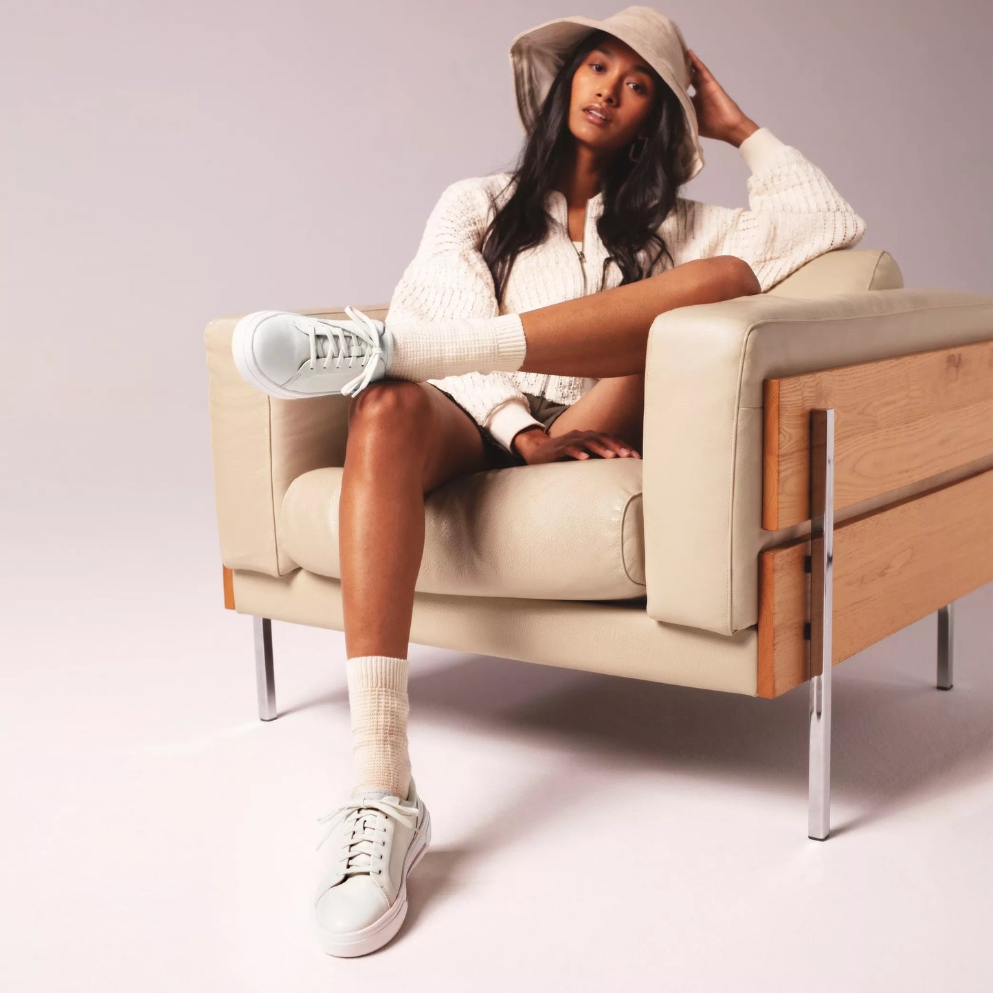 Woman wearing the Clarks Off White Leather Hollyhock Walk Women's Sneaker