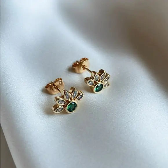 The Rafaela Studs by Tramps + Thieves are 14K Gold-Filled Stud earrings with beautiful emerald and clear CZ stones. Shop these earrings at Harbour Thread.