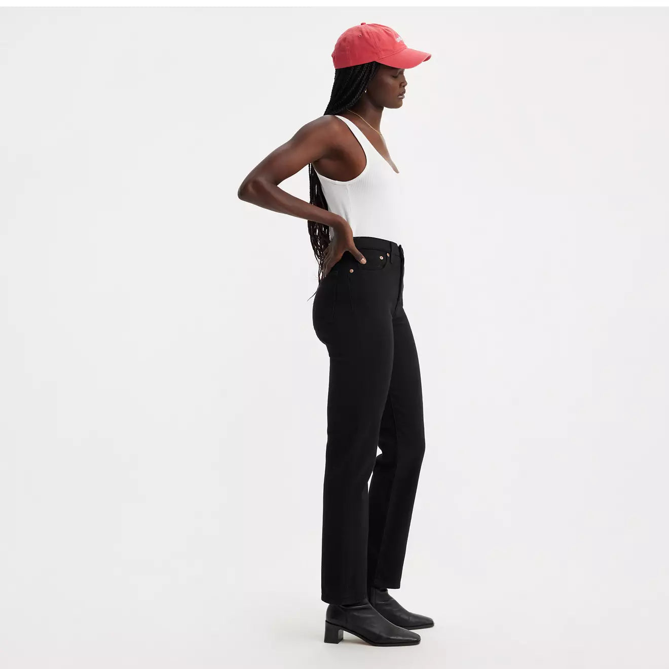 Side view of a woman wearing the Wedgie Straight Women's Jeans by Levi's in the color Black Sprout