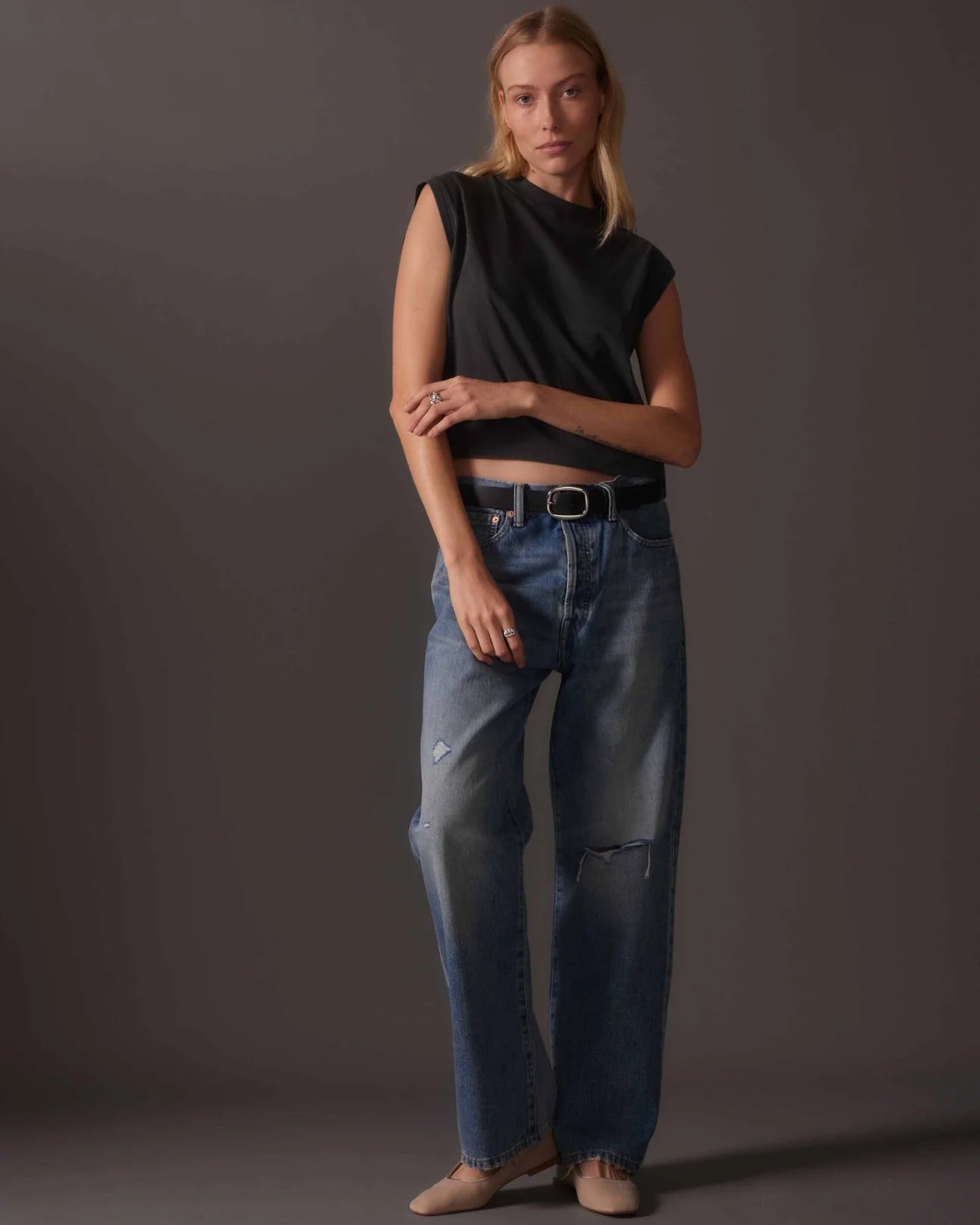 front full outfit view of model wearing a relaxed fit off black color muscle tee