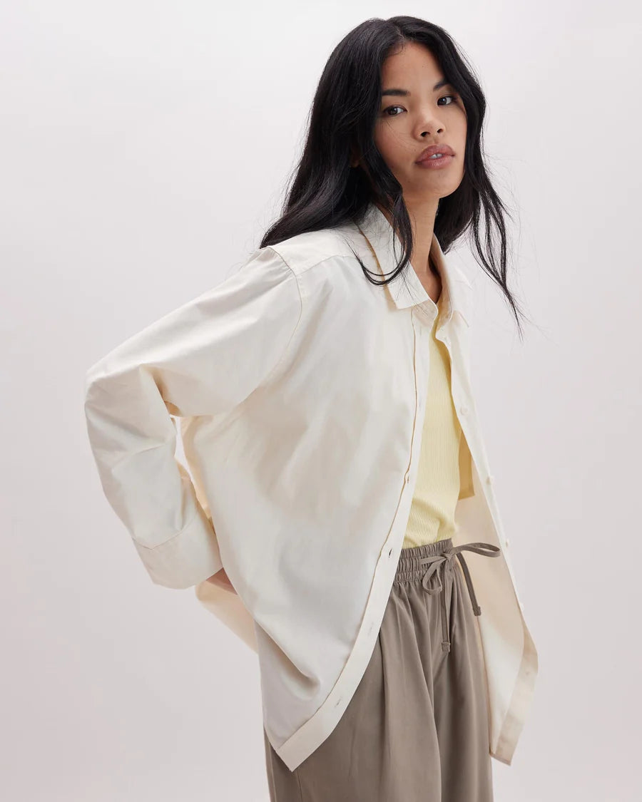 Side view of Richer Poorer's Venice Button Up Shirt in the color Bone