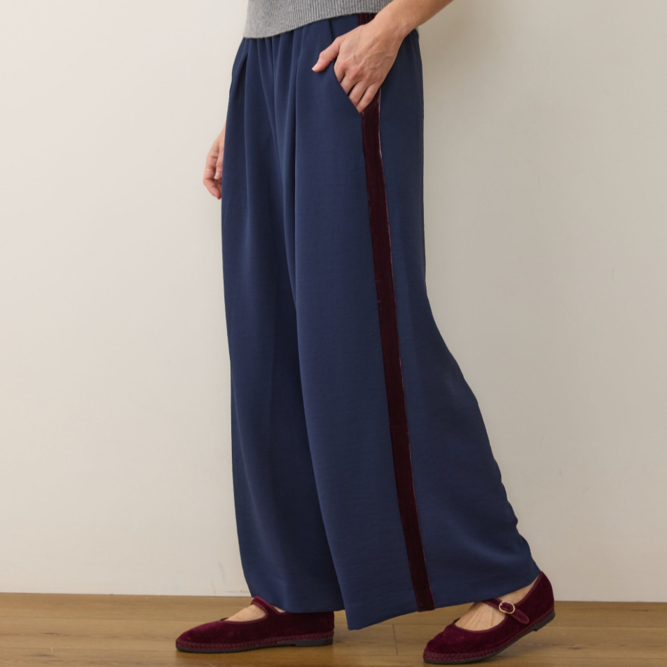 The Marine Layer Allison Pleated Wide Leg Trouser features a velvet side stripe detail with side pockets