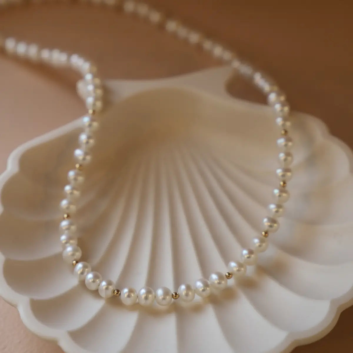 The Katie Waltman Kailani Necklace features freshwater nugget pearls and gold filled beads