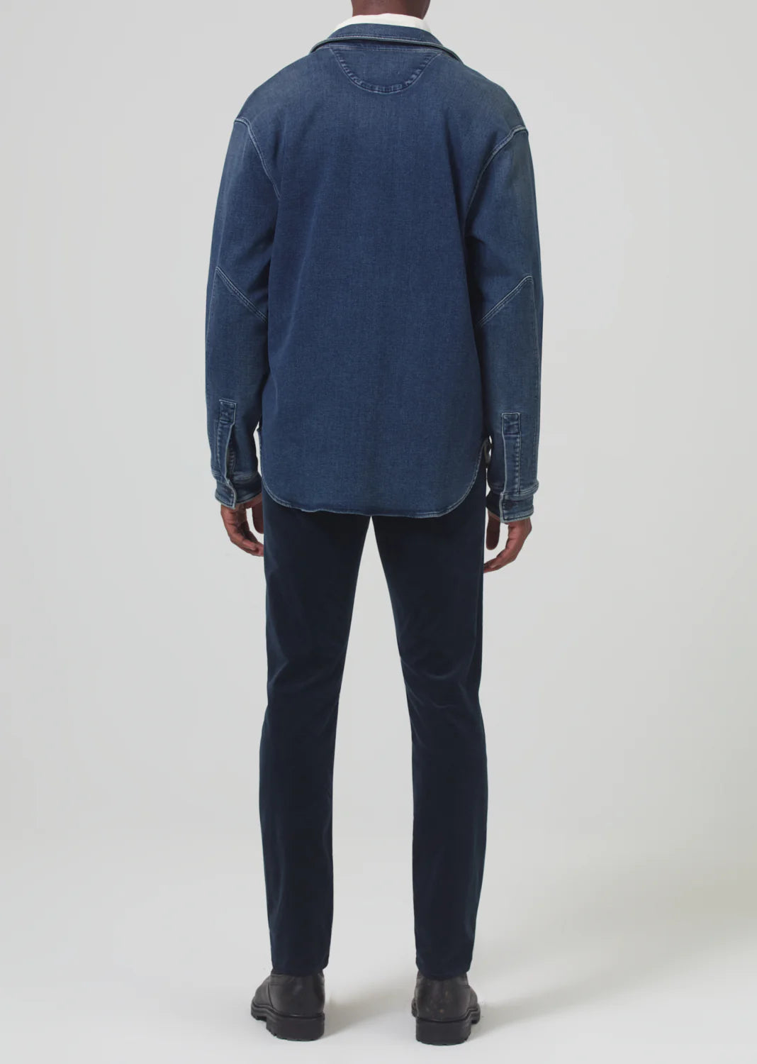 Back view of a man wearing the Navy London Tapered Slim Velvet men's pant by Citizens Of Humanity