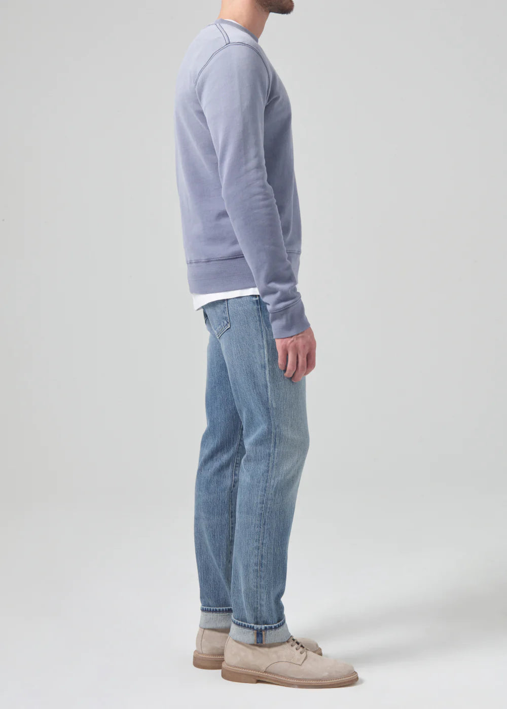 Side view of the medium indigo Citizens Of Humanity Gage Slim Straight Archive Men's Jeans