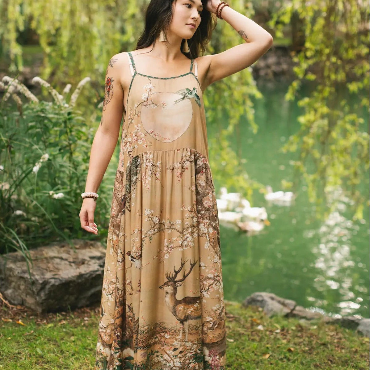 Woman wearing the Market Of Stars Fable Bohéme Long Maxi Slip Dress w/ Blossoms, Deer & Moon