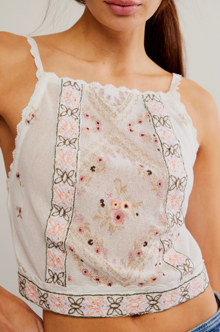 The Free People Garden Party Top features Intricate cross-stitched embroidery