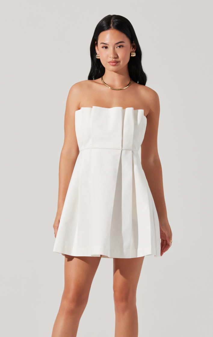 This ASTR mini dress at Harbour Thread offers a strapless design with pleating detail and is perfect for bridal events or semi-formal events.