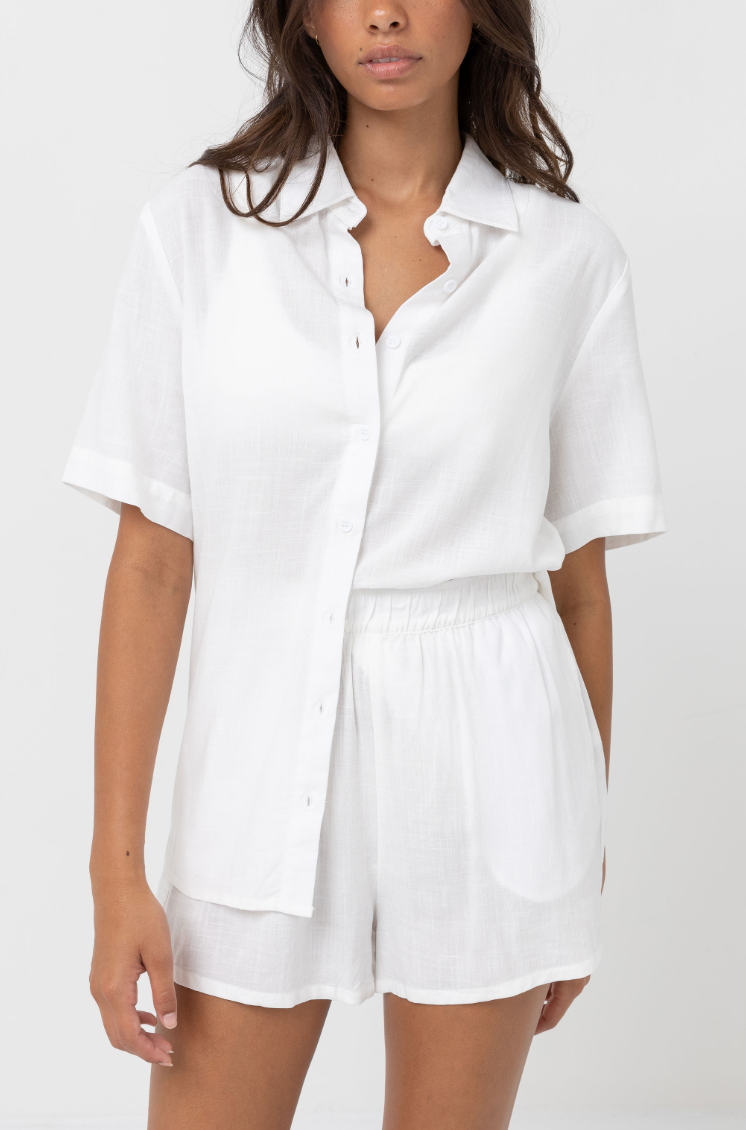 The women's Classic Lounge Shirt by Rhythm is a versatile warm weather top available at Harbour Thread in the color White
