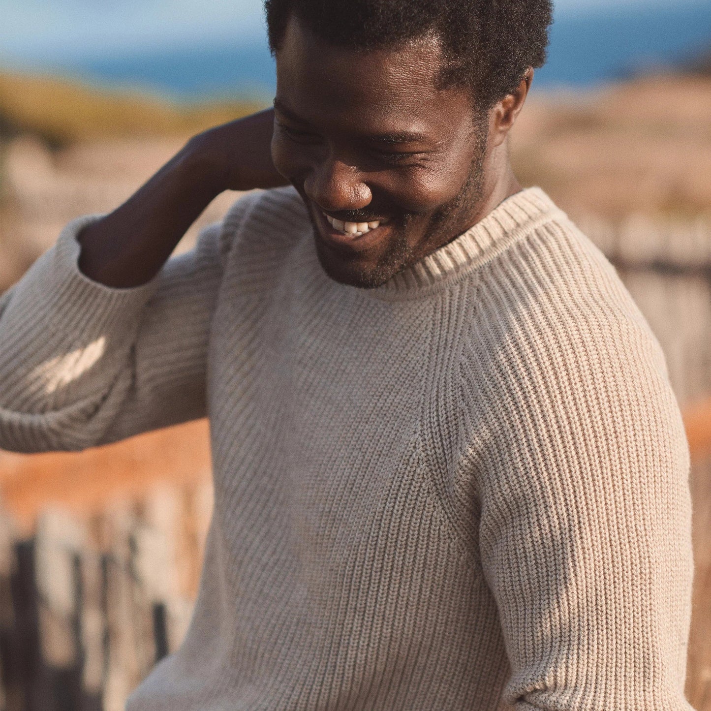 Man wearing a beige sweater from Marine Layer