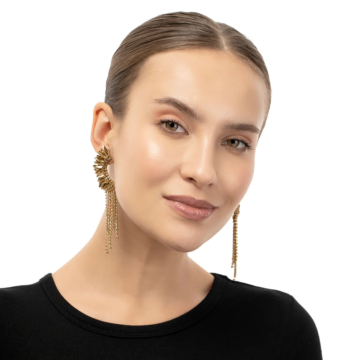 A woman wearing the Gold Estella Earrings by Deepa Gurnani