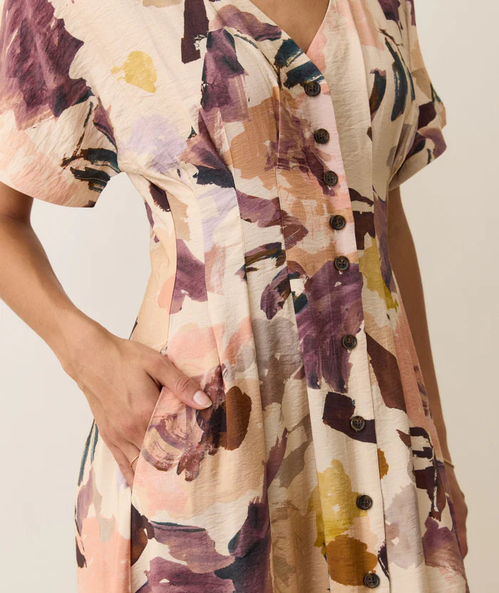 Woman wearing a floral dress from Marine Layer