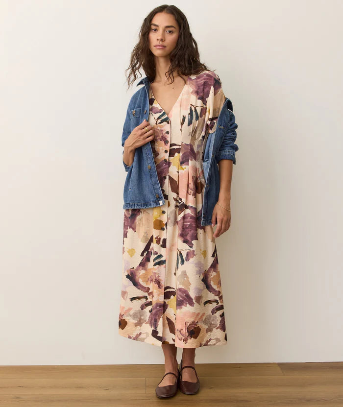 The Naomi Midi Dress offers a flattering defined waist, flowy skirt and lovely watercolor floral print. Find yours today at Harbour Thread in Burlington, VT.