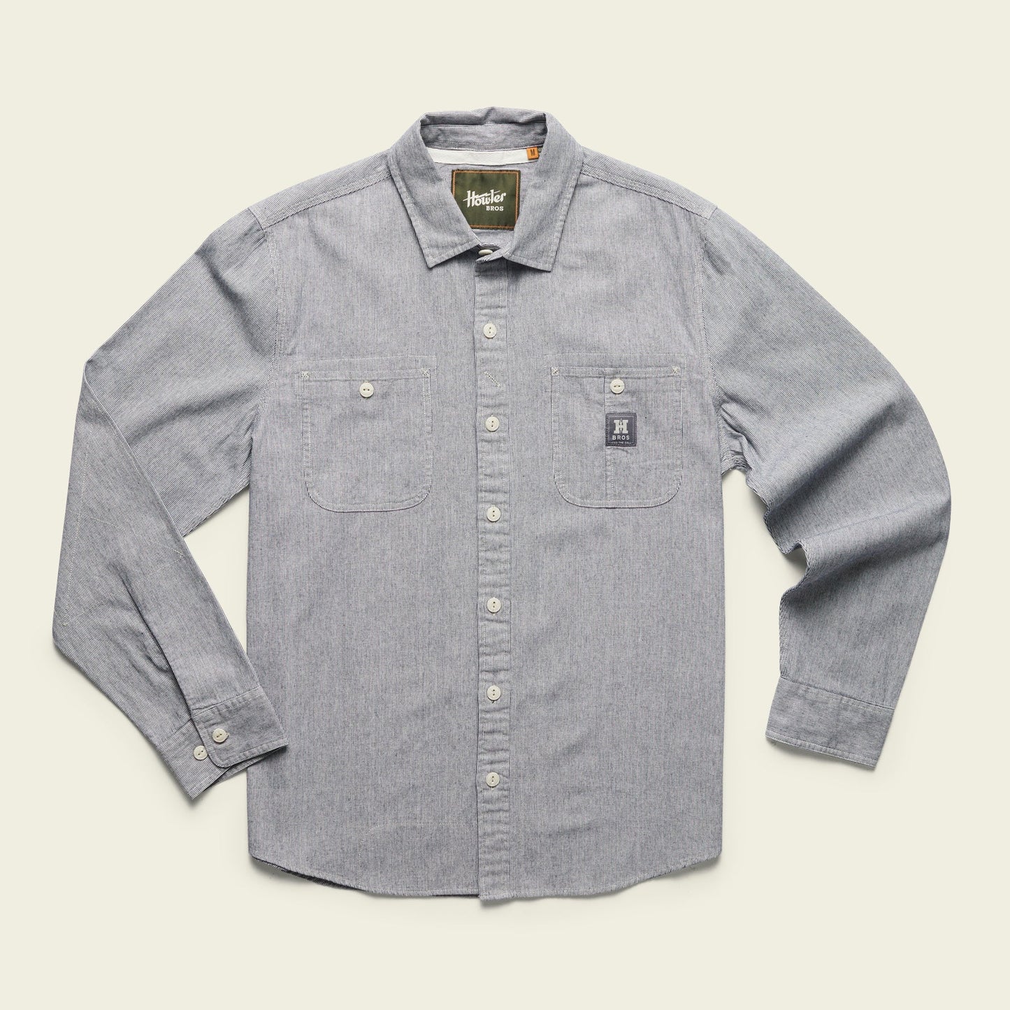 The Howler Bros Tallier Work Shirt in the color Hickory Stipe Chambray