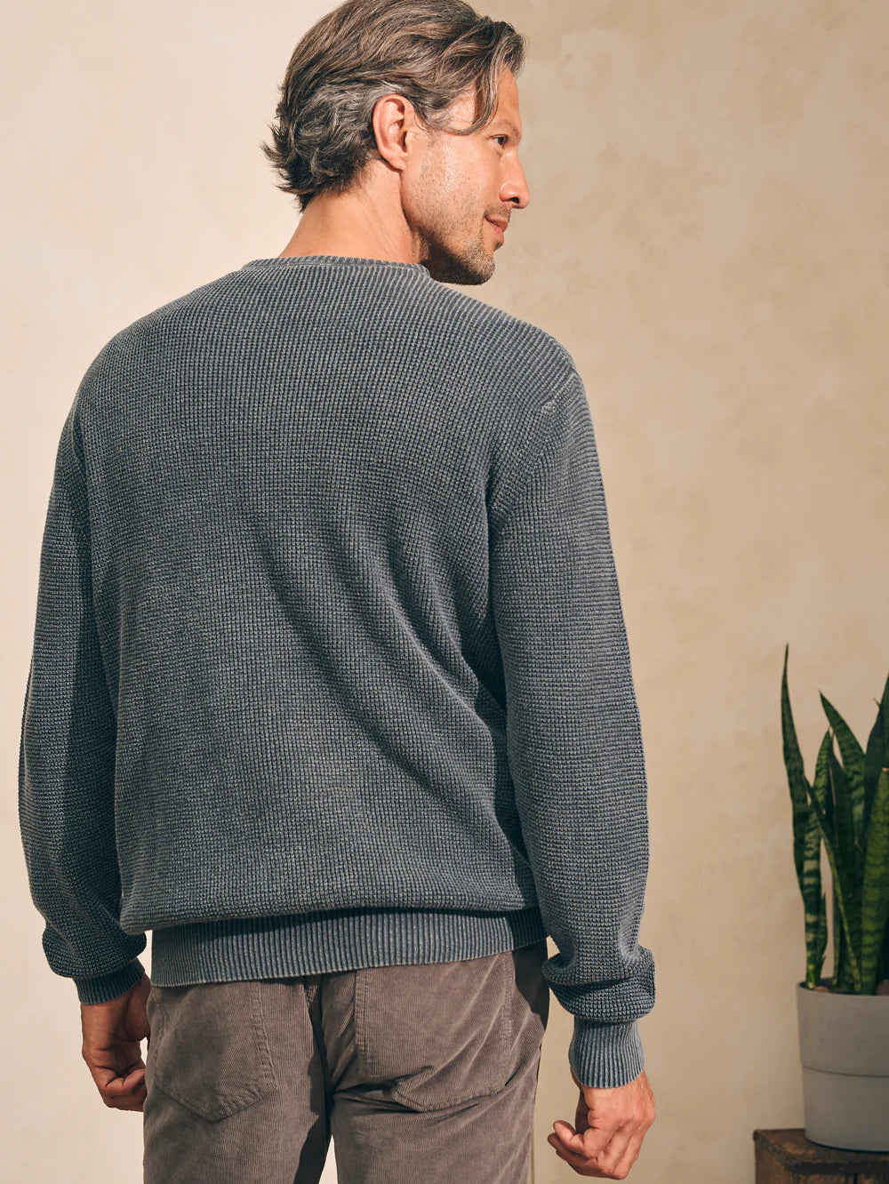 Back view of the Faded Black Sunwashed Crewneck Sweater by Faherty