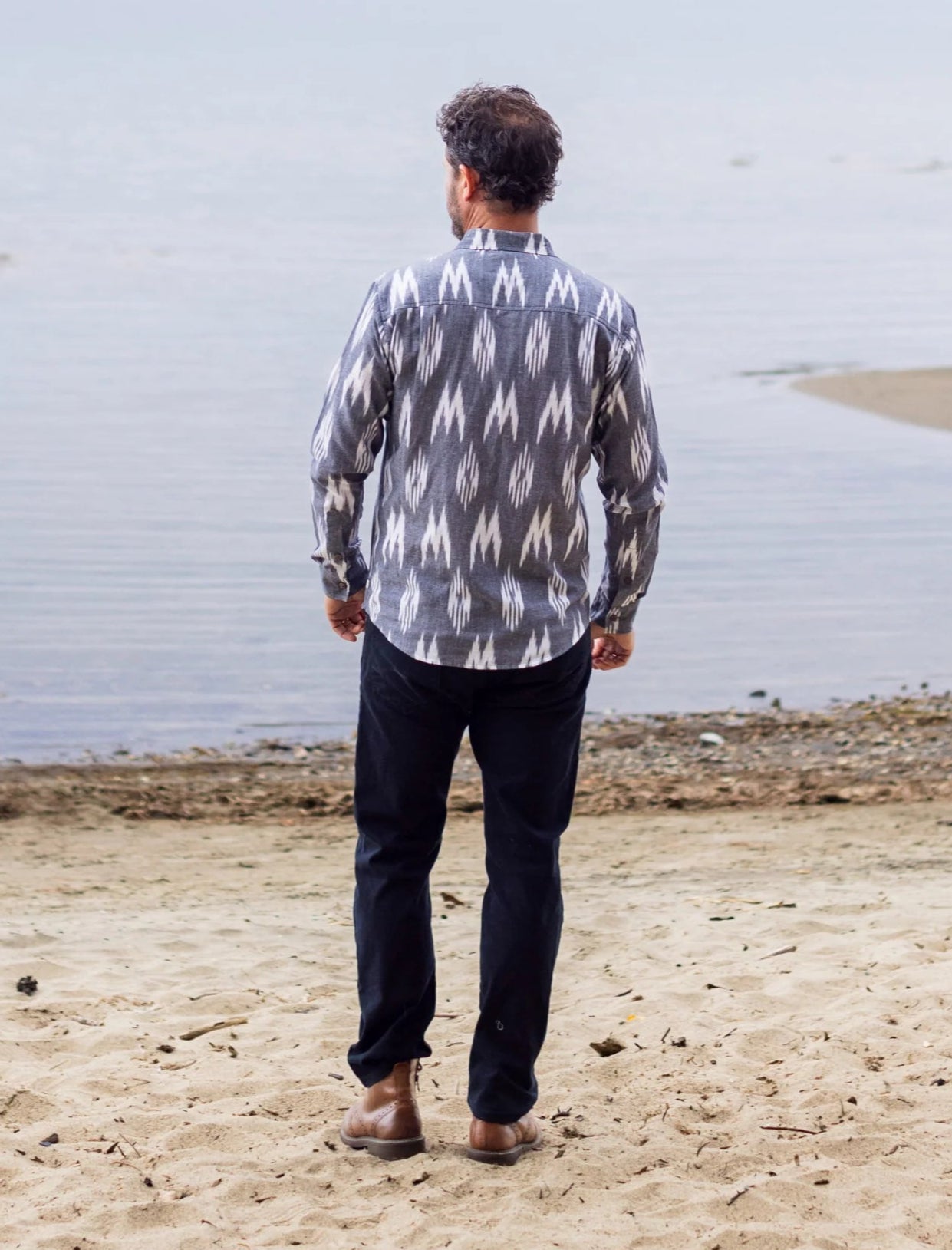 this grey and white long sleeve ikat print men's shirt offers versatile style for any occasion.