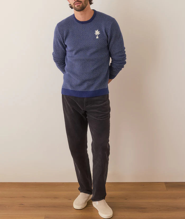 An outfit styled with the Birdseye Crewneck and a pair of black jeans with slip on sneakers