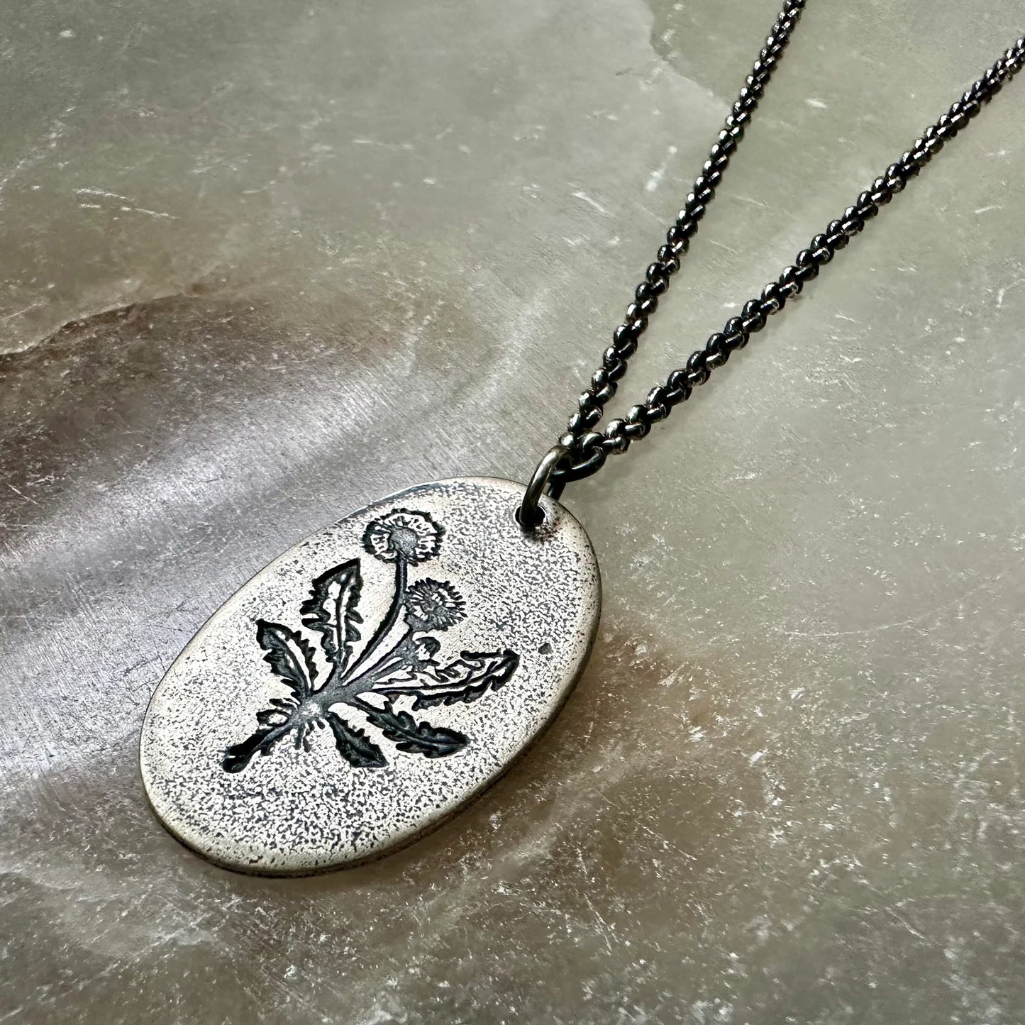 Shop the Jennifer Kahn Dandelion Medallion Necklace in Silver for a simple yet powerful statement.