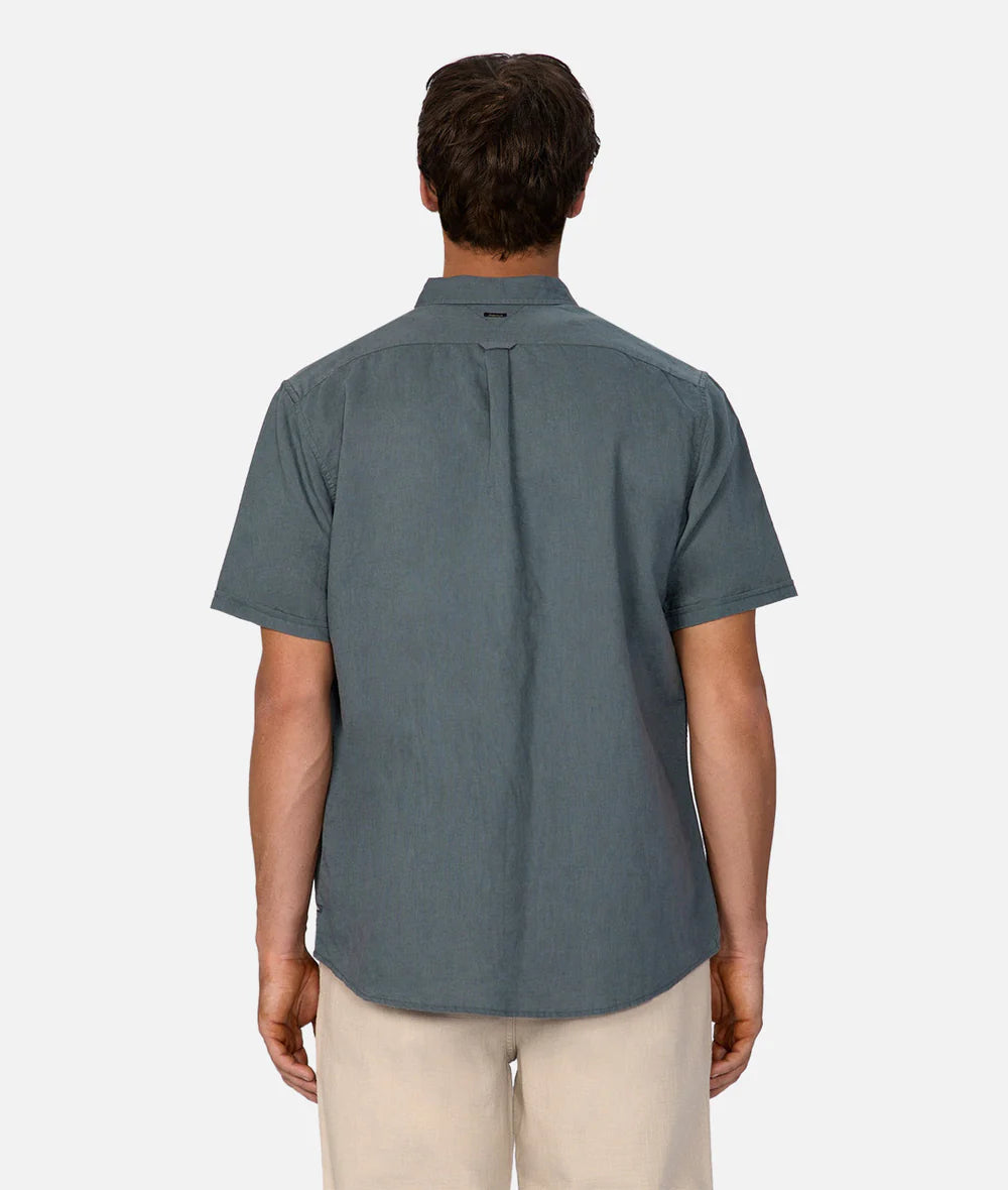 Man wearing a gray short-sleeve shirt on a white background