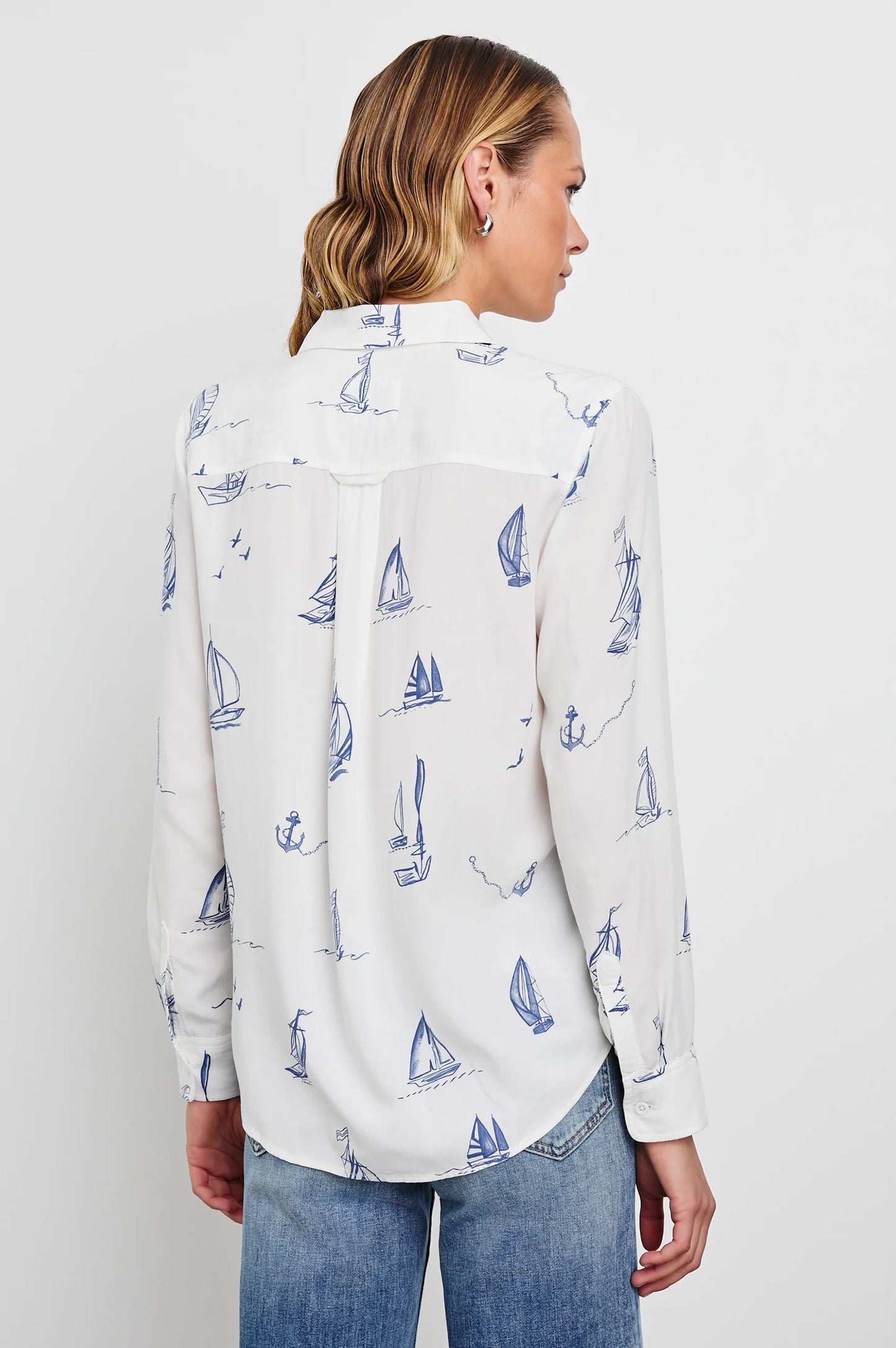 Long sleeve white button down shirt with blue sailboat prints