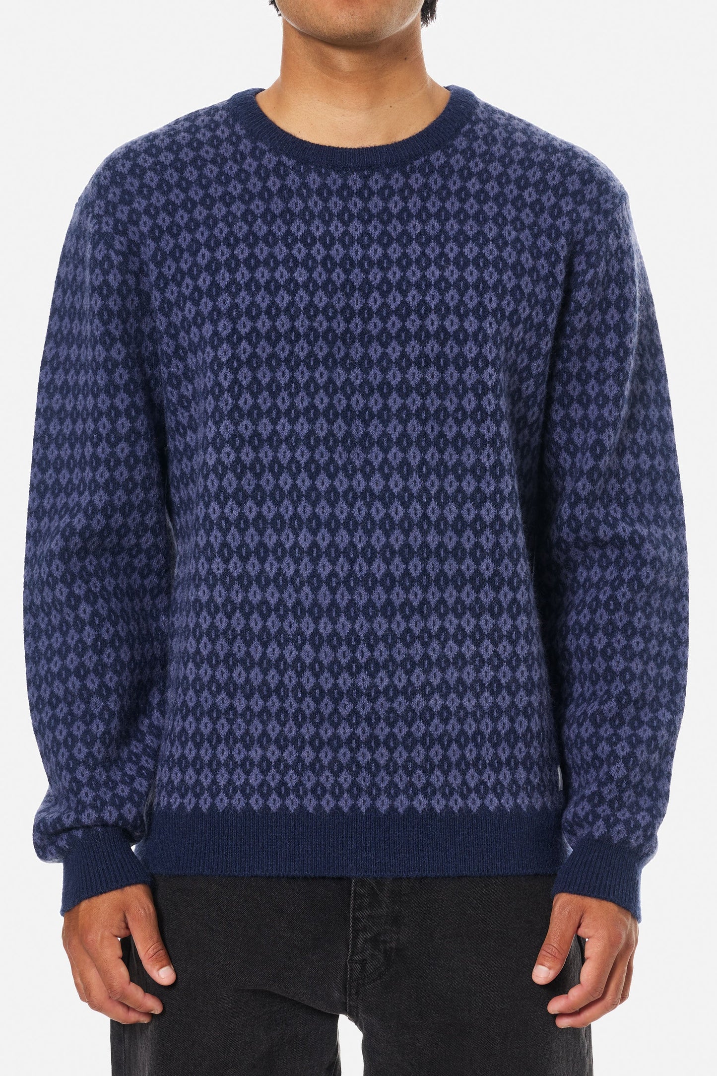 Person wearing a blue patterned sweater from Katin