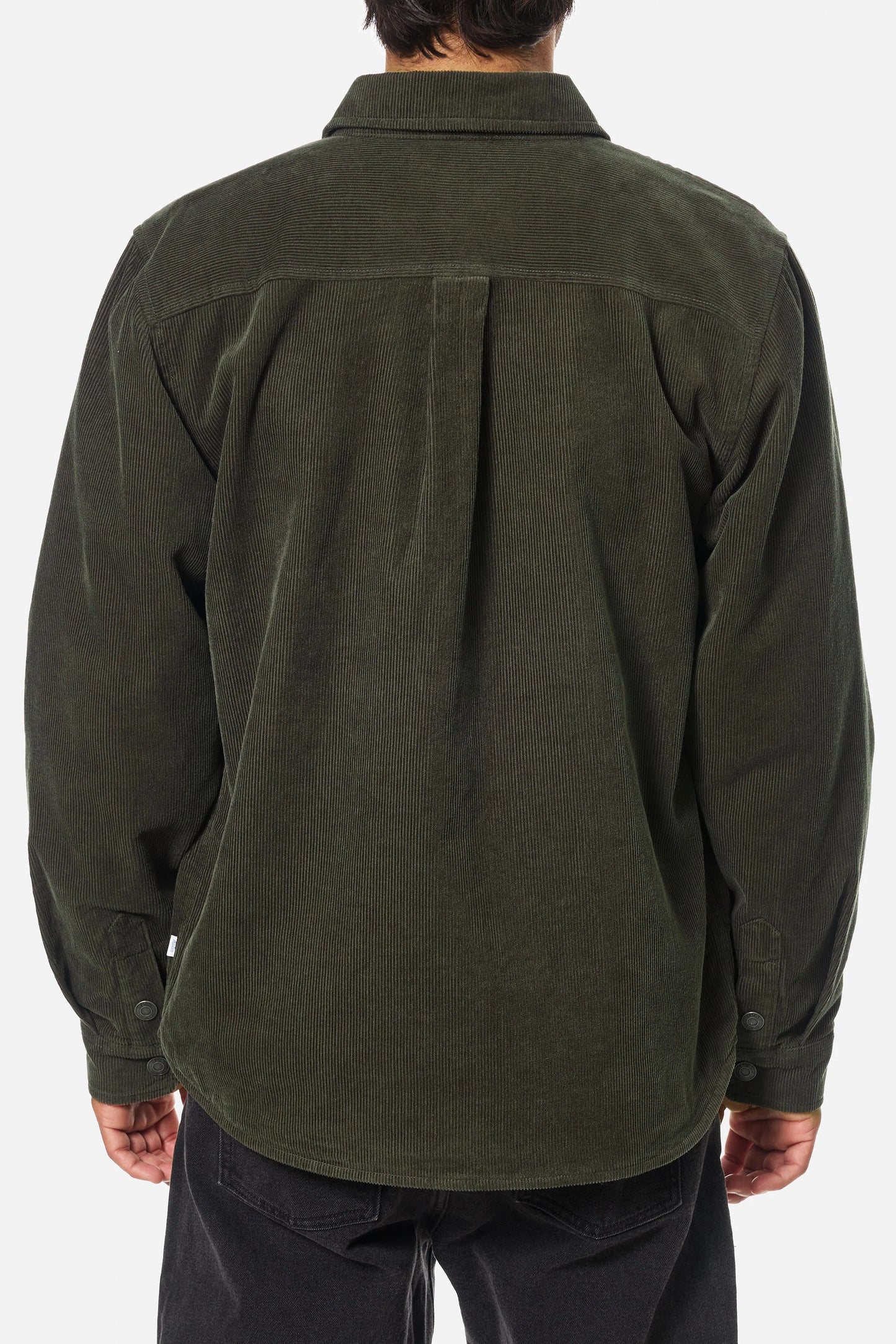 Man wearing a dark green corduroy shirt jacket from Katin