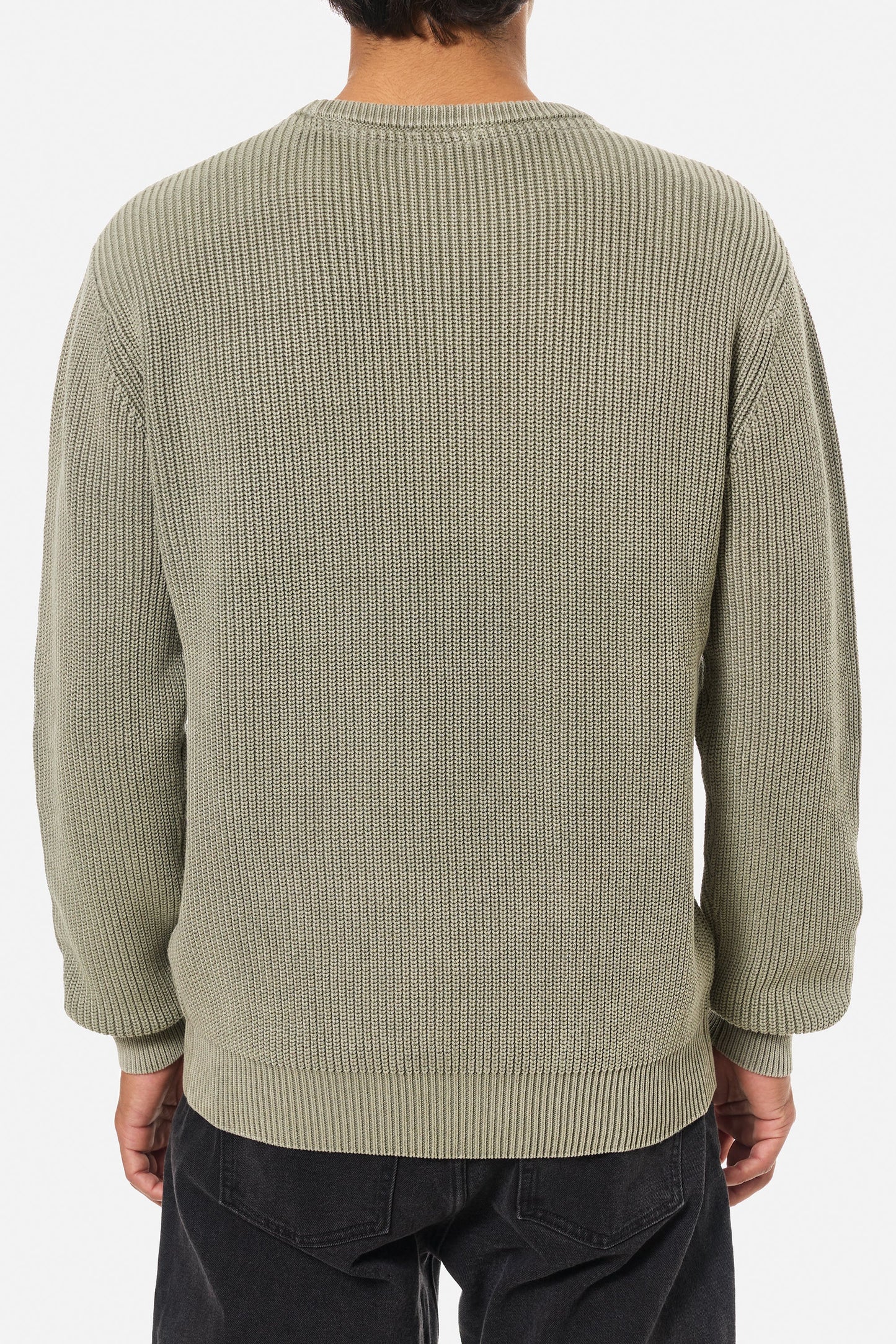 Man wearing the light green Swell Sweater  from Katin
