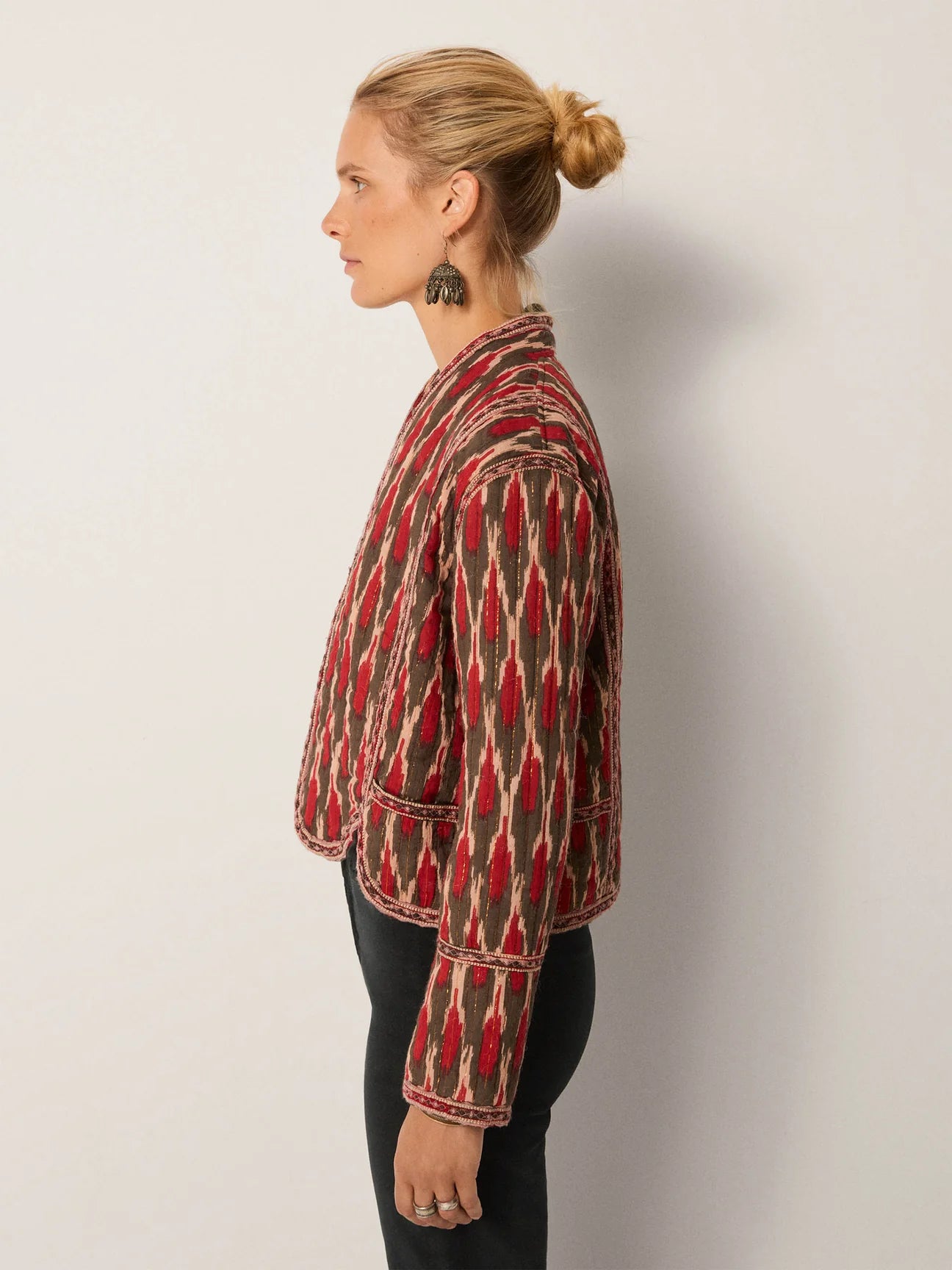 Woman wearing a patterned jacket with long sleeves from Maison Hotel