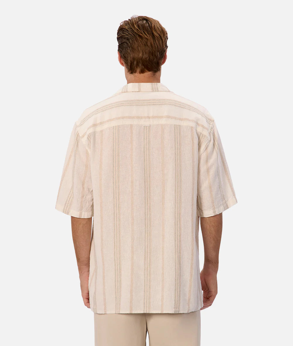 Man wearing a beige striped shirt on a white background