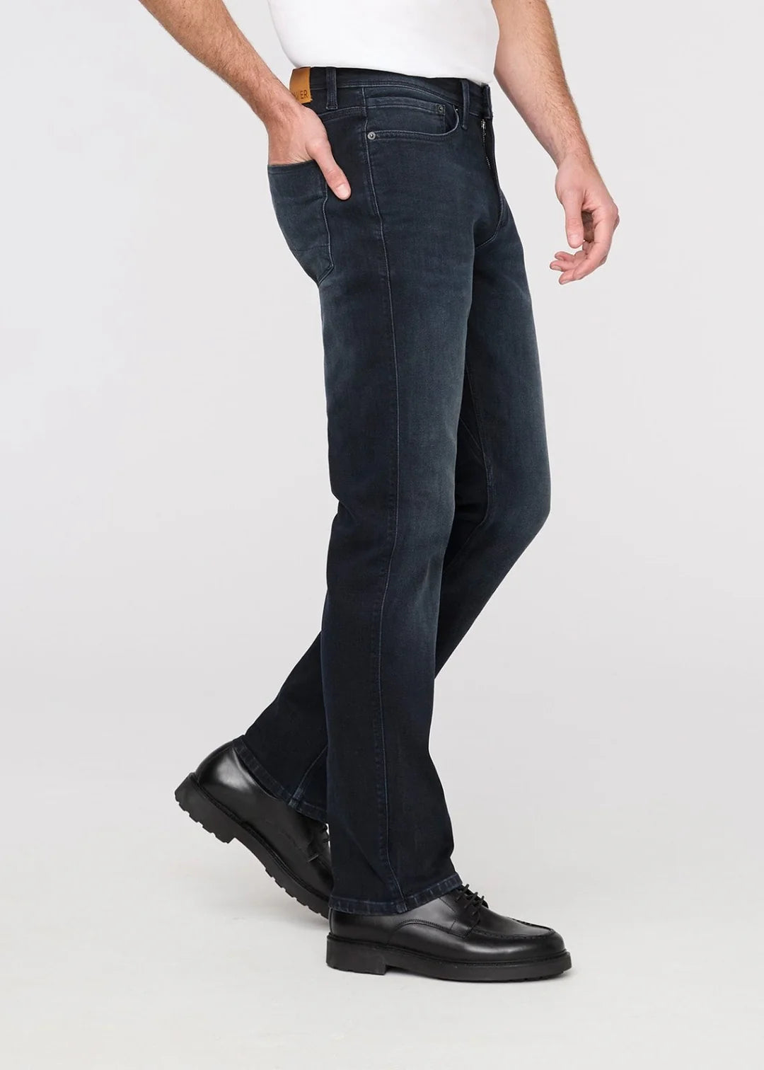 The DUER Performance Denim+ Slim Straight Men's Jeans in the dark wash color Carbon Stone